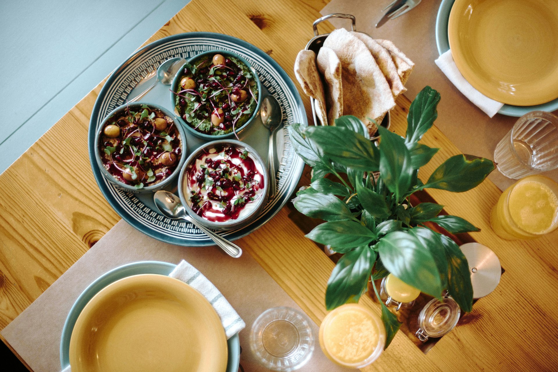 Delicious food is served on a wooden table.